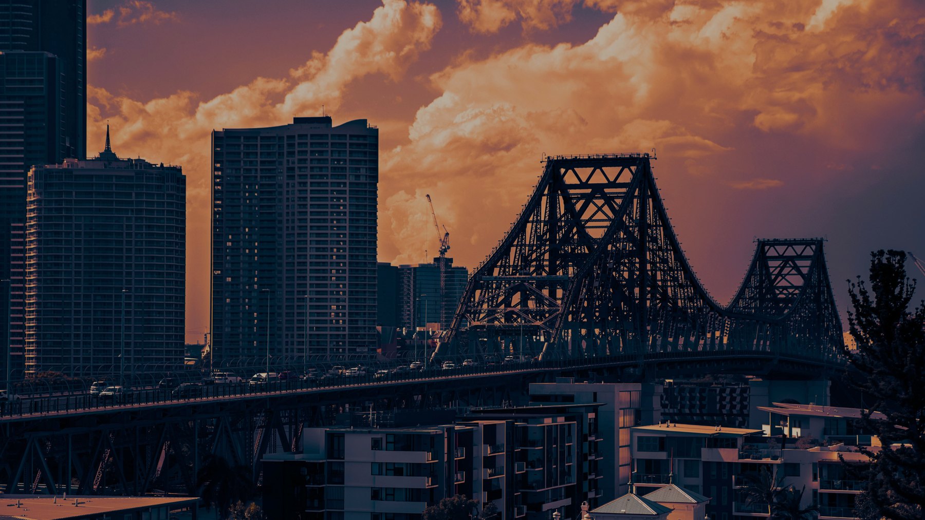 Brisbane’s Story Bridge and city buildings at sunset
